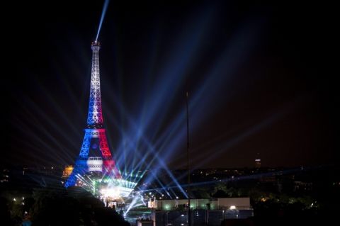 epa05354059 French DJ David Guetta performs on the main stage in the UEFA EURO 2016 Fan Zone at Champ de Mars near the Eiffel Tower as part of the EURO 2016 pre-opening show in Paris, France, 09 June 2016. The UEFA EURO 2016 soccer championship takes place from 10 June to 10 July 2016 in France.  EPA/JEREMY LEMPIN