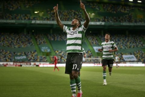 Sporting's Wendel celebrates after scoring the opening goal during the Portuguese League soccer match between Sporting CP and Gil Vicente at the Jose Alvalade stadium in Lisbon, Portugal, Wednesday, July 1, 2020. The Portuguese League soccer matches are being played without spectators because of the coronavirus pandemic. (Mario Cruz/Pool via AP)