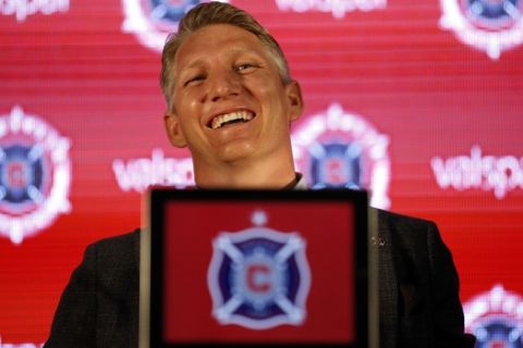The Chicago Fire's new player Basitan Schweinsteiger smiles as he listens to a question during a press conference at the The PrivateBank Fire Pitch in Chicago, Wednesday, March 29, 2017. (AP Photo/Nam Y. Huh)