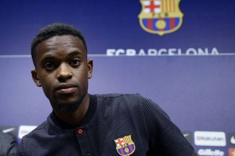 FC Barcelona's new signing Nelson Semedo arrives for a press conference during his official presentation at the Camp Nou stadium in Barcelona, Spain, Friday, July 14, 2017. (AP Photo/Manu Fernandez)