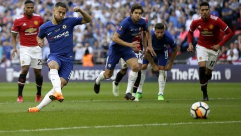 Chelsea's Eden Hazard, 2nd left, shoots a penalty to score the opening goal during the English FA Cup final soccer match between Chelsea and Manchester United at Wembley stadium in London, Saturday, May 19, 2018. (AP Photo/Tim Ireland)