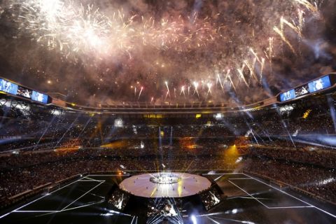 Real Madrid supporters watch fireworks as the team celebrate after winning the Champions League final, at the Santiago Bernabeu stadium in Madrid, Spain, Sunday, June 4, 2017. Real Madrid became the first team in the Champions League era to win back-to-back titles with their 4-1 victory over Juventus in Cardiff, Wales, on Saturday. (AP Photo/Francisco Seco)