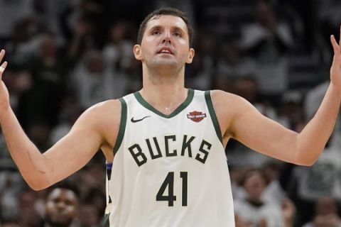 Milwaukee Bucks' Nikola Mirotic reacts to his three-point basket during the second half of Game 2 of a second round NBA basketball playoff series against the Boston Celtics Tuesday, April 30, 2019, in Milwaukee. The Bucks won 123-102 to tie the series at 1-1. (AP Photo/Morry Gash)