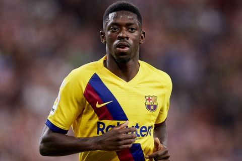 Barcelona's Ousmane Dembele runs during the Spanish La Liga soccer match between Athletic Bilbao and FC Barcelona at San Mames stadium in Bilbao, northern Spain, Friday, Aug. 16, 2019. (AP Photo/Ion Alcoba Beitia)