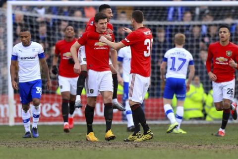 Manchester United's Harry Maguire celebrates scoring against Tranmere Rovers during the English FA Cup fourth round soccer match at Prenton Park, Birkenhead, England, Sunday Jan. 26, 2020. (Simon Cooper/PA via AP)
