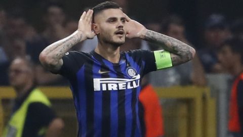 Inter forward Mauro Icardi celebrates after he scored his side's first goal during the Champions League, group B soccer match between Inter Milan and Tottenham Hotspur, at the Milan San Siro Stadium, Italy, Tuesday, Sept. 18, 2018. (AP Photo/Antonio Calanni)