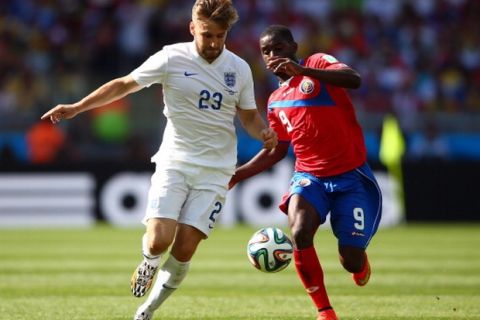 BELO HORIZONTE, BRAZIL - JUNE 24:  Luke Shaw of England competes for the ball with Joel Campbell of Costa Rica during the 2014 FIFA World Cup Brazil Group D match between Costa Rica and England at Estadio Mineirao on June 24, 2014 in Belo Horizonte, Brazil.  (Photo by Paul Gilham/Getty Images)