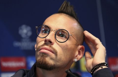Napoli's Marek Hamsik listens during a press conference at the Etihad Stadium, Manchester, England, Monday Oct. 16, 2017. Napoli will play Manchester City in a Champions League match Tuesday. (Martin Rickett/PA via AP)