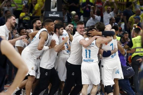 Real Madrid's players celebrate after winning their Final Four Euroleague final basketball match against Fenerbahce in Belgrade, Serbia, Sunday, May 20, 2018. (AP Photo/Darko Vojinovic)