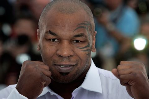 FILE - In this May 17, 2008 file photo, former heavyweight boxing champion Mike Tyson poses at the photo call for the film "Tyson" during the 61st International film festival in Cannes, southern France. Mike Tyson has scrapped promotional appearances in London because previous convictions bar him from entering Britain. His publisher said in a statement Tuesday Dec. 10, 2013 that it had been "unaware" of recent changes to U.K. immigration law and for that reason Tyson had to reroute to Paris. Under Britain's immigration rules, anyone sentenced to more than four years in prison is barred from entering the country. (AP Photo/Carlo Allegri, File) ORG XMIT: LON186