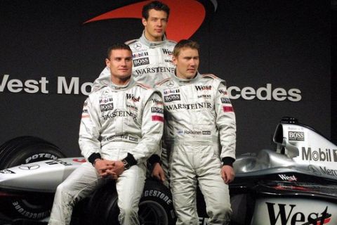Drivers Mika Hakkinen, right, of Finland,  Alexander Wurtz of Austria and Scotland's David Coulthard, left,  pose for photographers at the presentation for the new West McLaren Mercedes Formula-1 at the Cheste race track outside Valencia, eastern Spain, Wednesday Feb. 7, 2001. (AP Photo/Ramon Espinosa)