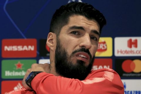 Barcelona's Luis Suarez gestures, during a press conference at Anfield Stadium, Liverpool, England, Monday May 6, 2019.  Liverpool are scheduled to play against Barcelona in a Champions League Semi-final second leg soccer match in Liverpool on Tuesday. (Peter Byrne/PA via AP)