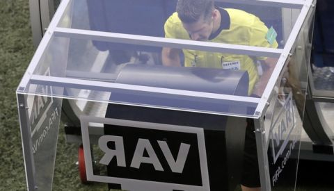 FILE - In this Friday, June 22, 2018 file photo, eeferee Matt Conger from New Zealand watches the Video Assistant Referee system, known as VAR during the group D match between Nigeria and Iceland at the 2018 soccer World Cup in the Volgograd Arena in Volgograd, Russia. The video assistant referee system has been much talked about since being used at the World Cup earlier this year, and on Sunday Sept. 30, 2018, VAR stopped working during the 1-1 draw between Rennes and Toulouse. (AP Photo/Themba Hadebe, File)
