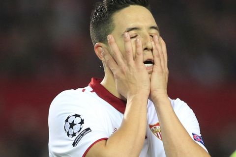 Sevilla's Samir Nasri holds his face after a missed opportunity during the Champions League round of 16 soccer match between Sevilla and Leicester City at the Ramon Sanchez-Pizjuan stadium in Seville, Spain, Wednesday, Feb. 22, 2017. (AP Photo/Miguel Morenatti)