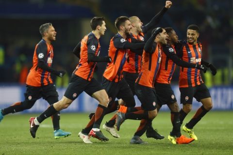 Shakhtar's Fred celebrates with his teammates after scoring his side's second goal during the Champions League, round of 16, first-leg soccer match between Shakhtar Donetsk and Roma at the Metalist Stadium in Kharkiv, Ukraine, Wednesday, Feb. 21, 2018. (AP Photo/Efrem Lukatsky)