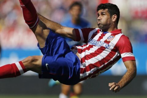 FILE - In this Sept. 14, 2013 file photo, Atletico de Madrid's Diego Costa tries an overhead kick on goal during a Spanish La Liga soccer match against Almeria at the Vicente Calderon stadium in Madrid, Spain. Atletico Madrid and Chelsea said on Thursday Sept. 21, 2017 that they have reached an agreement for the transfer of striker Diego Costa to the Spanish club who will undergo a medical and finalize the contract details with his former club. (AP Photo/Paul White, File)