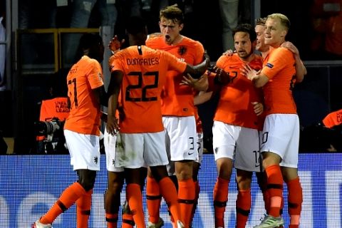 Netherlands' Matthijs de Ligt, center, celebrates with his teammates after scoring his side's opening goal during the UEFA Nations League semifinal soccer match between Netherlands and England at the D. Afonso Henriques stadium in Guimaraes, Portugal, Thursday, June 6, 2019. (AP Photo/Martin Meissner)