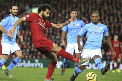 Liverpool's Mohamed Salah makes an attempt to score during the English Premier League soccer match between Liverpool and Manchester City at Anfield stadium in Liverpool, England, Sunday, Nov. 10, 2019. (AP Photo/Jon Super)