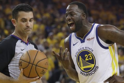 Golden State Warriors forward Draymond Green (23) argues with referee Zach Zarba during the first half of Game 1 of a second-round NBA basketball playoff series against the Houston Rockets in Oakland, Calif., Sunday, April 28, 2019. (AP Photo/Jeff Chiu)