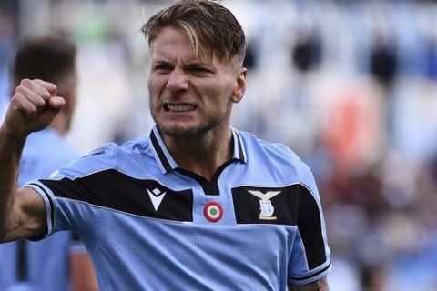 Lazio's Ciro Immobile celebrates after scoring his side's opening goal during the Serie A soccer match between Lazio and Spal, at the Rome Olympic Stadium Sunday, Feb. 2, 2020. (Alfredo Falcone/Lapresse via AP)