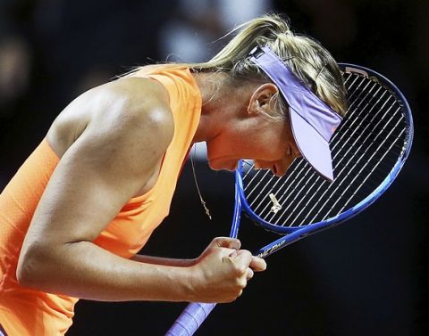 Russia's Maria Sharapova reacts after winning 7-5, 6-3 against Italy's Roberta Vinci at the Porsche Tennis Grand Prix in Stuttgart, Germany, Wednesday, April 26, 2017. It was Sharapova's first match after a 15 months lasting doping ban. (AP Photo/Michael Probst)