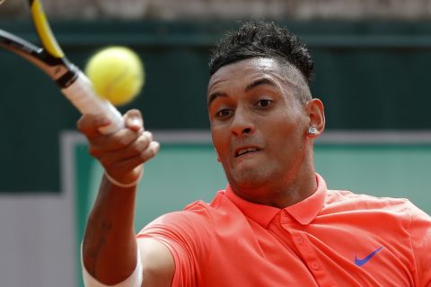 Australia's Nick Kyrgios returns the ball to Uzbekistan's Denis Istomin during their first round match of the French Open tennis tournament at the Roland Garros stadium, Monday, May 25, 2015 in Paris,  (AP Photo/Michel Euler)