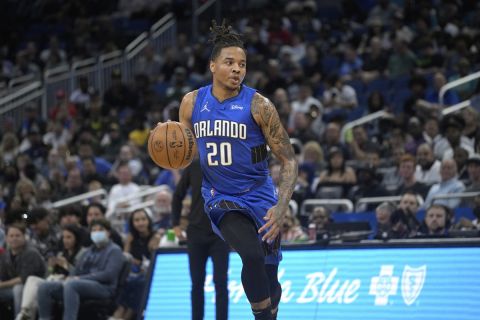 Orlando Magic guard Markelle Fultz (20) drives to the basket during the first half of an NBA basketball game against the Brooklyn Nets, Tuesday, March 15, 2022, in Orlando, Fla. (AP Photo/Phelan M. Ebenhack)