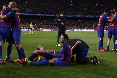 Barcelona players celebrate their victory at the end of the Champion League round of 16, second leg soccer match against Paris Saint Germain at the Camp Nou stadium in Barcelona, Spain, Wednesday March 8, 2017. (AP Photo/Emilio Morenatti)