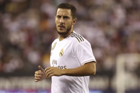 Real Madrid forward Eden Hazard in action during the second half of an International Champions Cup soccer match against Atletico Madrid, Friday, July 26, 2019, in East Rutherford, N.J. Atletico Madrid won 7-3. (AP Photo/Steve Luciano)