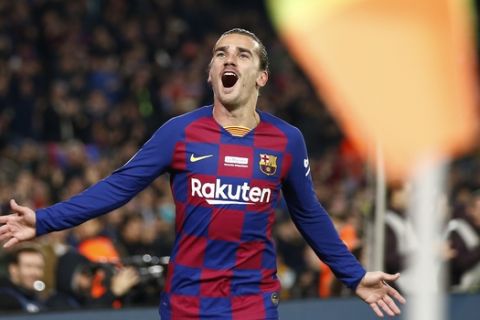 Barcelona's Antoine Griezmann celebrates after scoring the opening goal during a Spanish La Liga soccer match between Barcelona and Mallorca at Camp Nou stadium in Barcelona, Spain, Saturday, Dec. 7, 2019. (AP Photo/Joan Monfort)
