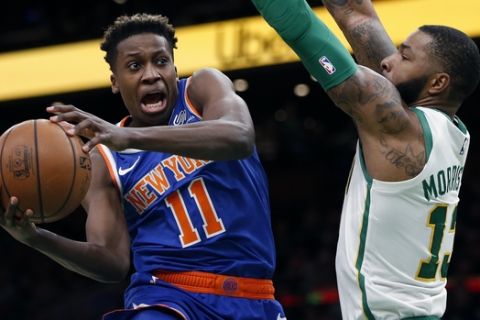 New York Knicks' Frank Ntilikina (11) drives for the basket against Boston Celtics' Marcus Morris (13) during the second half on an NBA basketball game in Boston, Wednesday, Nov. 21, 2018. (AP Photo/Michael Dwyer)