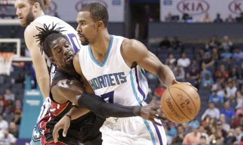 Charlotte Hornets' Ramon Sessions (7) drives against Miami Heat's Briante Weber (12) in the first half of a preseason NBA basketball game in Charlotte, N.C., Thursday, Oct. 20, 2016. (AP Photo/Chuck Burton)