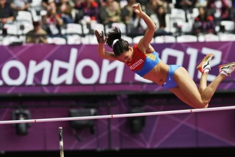 Russia's Yelena Isinbayeva competes in a women's pole vault qualification round during the athletics in the Olympic Stadium at the 2012 Summer Olympics, London, Saturday, Aug. 4, 2012. (AP Photo/David J. Phillip)