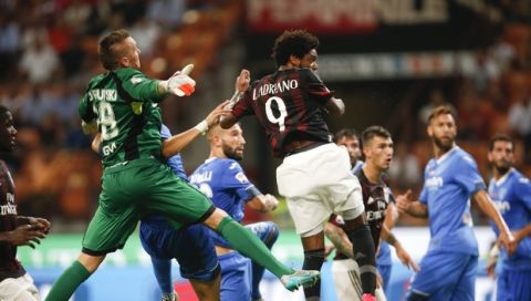 AC Milan's Luiz Adriano scores during a Serie A soccer match between AC Milan and Empoli, at the San Siro stadium in Milan, Italy, Saturday, Aug. 29, 2015. (AP Photo/Luca Bruno)