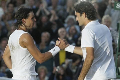 FILE - In this Sunday, July 6, 2008 file photo Spain's Rafael Nadal left, shakes the hand of Switzerland's Roger Federer after winning the men's final on the Centre Court at Wimbledon. After going more than 1½ years without playing each other anywhere, Roger Federer and Rafael Nadal will be meeting at a second consecutive Grand Slam tournament when they face off in Wimbledon's semifinals. (AP Photo/Anja Niedringhaus, File)
