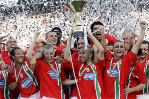 **  FILE ** Juventus's Alessandro del Piero holds aloft the trophy after his team clinched its second straight Serie A soccer title, in this file picture taken at the Bari San Nicola stadium, Italy, on May 14, 2006. Once Italy's blue chip soccer club, Juventus has been taking a beating on the Milan stock exchange in the wake of accusations that officials influenced referee appointments and carried out other illicit behavior in a wide-ranging soccer scandal.  (AP Photo/Antonio Calanni)