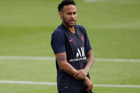 FILE - In this Aug. 10, 2019, photo, PSG's Neymar attends a training session at Camp des Loges in Saint Germain en Laye, outside Paris, France. Neymar looks set to stay at Paris Saint-Germain as the clock ticks down on the French league's transfer window, which closed at midnight Monday, Sept. 2.(AP Photo/Francois Mori, File)