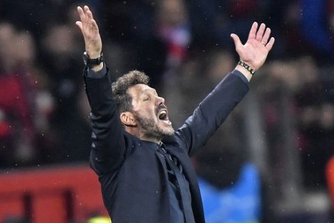 Atletico Madrid coach Diego Simeone gestures during the Champions League, Group D, soccer match between Leverkusen and Atletico Madrid at the BayArena in Leverkusen, Germany, Wednesday, Nov. 6, 2019. (AP Photo/Martin Meissner)