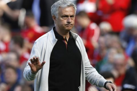 Manchester United manager Jose Mourinho leaves the pitch after the final whistle of the English Premier League soccer match between Manchester United and Watford at Old Trafford, in  Manchester, England, Sunday, May 13, 2018. (Martin Rickett/PA via AP)