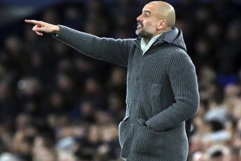 Manchester City manager Pep Guardiola gestures on the touchline during their English Premier League soccer match against Everton at Goodison Park, Liverpool, England, Wednesday, Feb. 6, 2019. (Peter Byrne/PA via AP)