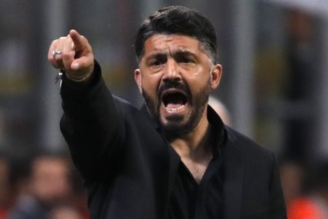 AC Milan coach Gennaro Gattuso gives instructions from the side line during the Italian Serie A soccer match between AC Milan and Bologna at the San Siro stadium, in Milan, Italy, Monday, May 6, 2019. (AP Photo/Antonio Calanni)
