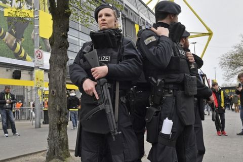Police secure the area in front of the stadium, prior to the Champions League first leg quarterfinal soccer match between Borussia Dortmund and AS Monaco in Dortmund, Germany, Wednesday, April 12, 2017. (AP Photo/Martin Meissner)