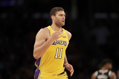 Los Angeles Lakers center Brook Lopez reacts after making a 3-pointer during the second half of an NBA basketball game against the Brooklyn Nets, Friday, Nov. 3, 2017, in Los Angeles. (AP Photo/Ryan Kang)