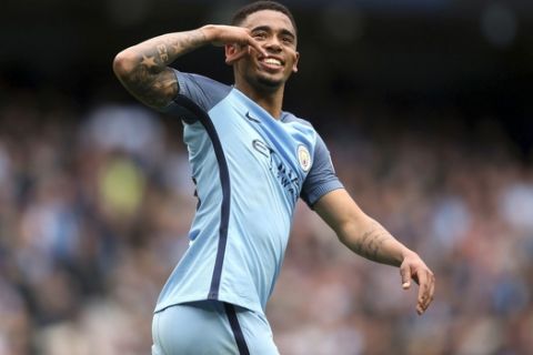 Manchester City's Gabriel Jesus celebrates scoring during the English Premier League soccer match between Manchester City and Leicester, at the Etihad Stadium, in Manchester, England, Saturday May 13, 2017. (Martin Rickett/PA via AP)