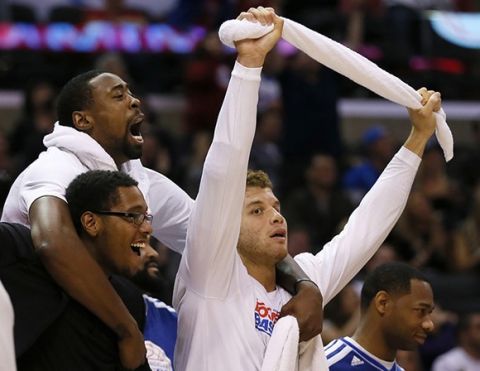 Los Angeles Clippers Trey Thompkins (L-R), DeAndre Jordan, and Blake Griffin celebrate during their win over the Dallas Mavericks in their NBA basketball game in Los Angeles, California, December 5, 2012. REUTERS/Lucy Nicholson (UNITED STATES - Tags: SPORT BASKETBALL) - RTR3B9D8