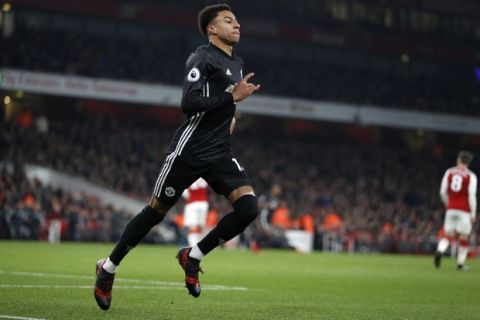 Manchester United's Jesse Lingard celebrates after scoring his side's second goal during the English Premier League soccer match between Arsenal and Manchester United at the Emirates stadium in London, Saturday, Dec. 2, 2017. (AP Photo/Kirsty Wigglesworth)