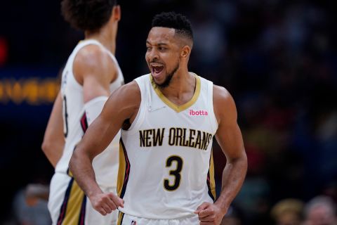 New Orleans Pelicans guard CJ McCollum (3) celebrates a basket in the second half of an NBA basketball game against the Chicago Bulls in New Orleans, Thursday, March 24, 2022. The Pelicans won 126-109. (AP Photo/Gerald Herbert)
