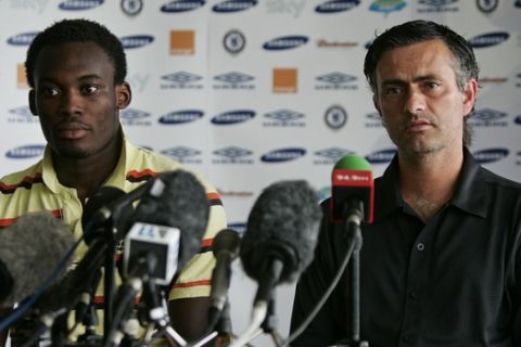 Chelsea's Portuguese manager Jose Mourinho, right, sits with Ghana international Michael Essien during a news conference to unveil the midfielder at the club's training ground in Cobham, Surrey, south east England, Friday Aug. 19, 2005.  Chelsea on Friday announced the signing of Essien, from the French club Lyon for a fee of 24.4 million pounds (US $43.8 million, 35.9 million Euros).  (AP Photo/Matt Dunham)