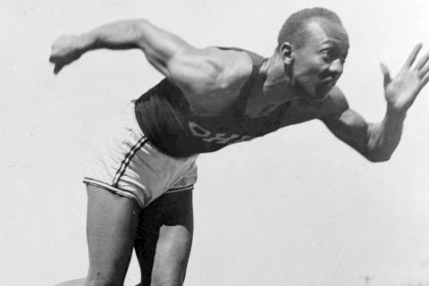 File - In this Aug. 5, 1936 file photo, American athlete Jesse Owens practices in the Olympic Village in Berlin. Shortly after Jesse Owens returned home from his snubbing by Adolph Hitler at the 1936 Olympics, he and America's 17 other black Olympians found a less-than-welcoming reception from their own government, as well. On Thursday, Sept. 29, 2016 relatives of those 1936 African-American Olympians will be welcomed to the White House and will get to shake the President's hand, an honor Owens and the others didnt receive after they returned home from Berlin 80 years ago. (AP Photo/File)