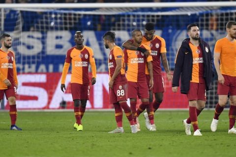 Galatasaray's players leave the pitch after losing the Champions League group D soccer match between FC Schalke 04 and Galatasaray Istanbul in Gelsenkirchen, Germany, Tuesday, Nov. 6, 2018. (AP Photo/Martin Meissner)
